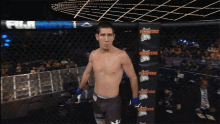 a fighter stands in front of a sign that says hooters