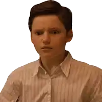 a young boy in a striped shirt is making a surprised face