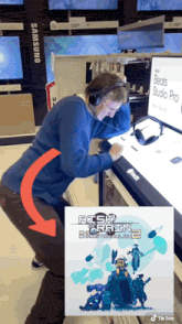 a man wearing headphones in a store next to a sign that says risk rain 2