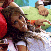 a woman laying on a couch with a picture of her on the bottom of the picture