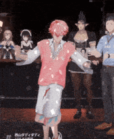 a man in a pink sweater and white shorts is dancing in front of a group of people