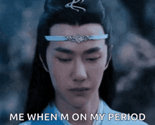 a man with long hair and a crown on his head says me when i m on my period