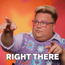 a man wearing glasses and a purple vest points to the right with the words right there below him