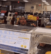 a man is behind a counter with a sign that says keep door closed