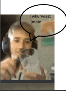 a man wearing headphones is holding a glass with a speech bubble that says " wkurwiasz mnie "
