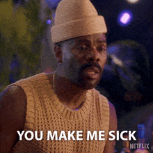a man is wearing a hat and sweater and says you make me sick