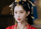 a close up of a woman wearing a red dress and earrings