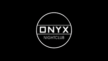the onyx nightclub logo is a white circle on a black background .