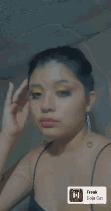 a close up of a woman 's face with a freak doja cat filter on it
