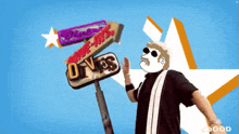 a man stands in front of a drive-in sign that says drive-ins
