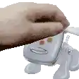 a close up of a person holding a remote control with a face on it .