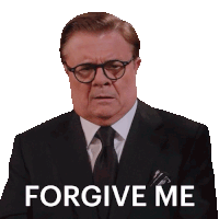 a man in a suit and tie has the words forgive me written on his face