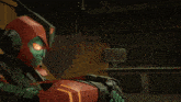 a couple of robots are sitting next to each other and one has blue eyes
