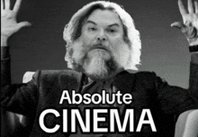 a black and white photo of a man with the words absolute cinema above him