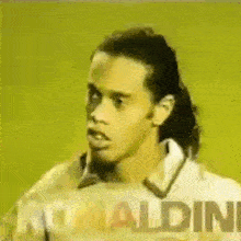 a close up of a soccer player 's face with the name ronaldo written on the bottom