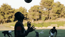 a soccer player throws a soccer ball in the air with the word forever in the bottom right corner