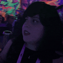 a woman 's face is behind a sign that says wepa on it