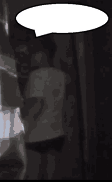 a blurry picture of a person with a speech bubble above their head