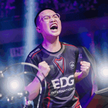 a man wearing a black edg international jersey