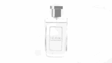 a black and white photo of a man spraying perfume