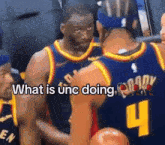a basketball player with the number 4 on his jersey is talking to another player .