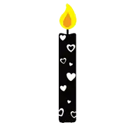 a black candle with white hearts on it and a flame