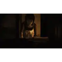 a man and a woman looking at each other in the dark