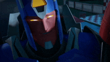 a close up of a robot 's face with glowing yellow eyes