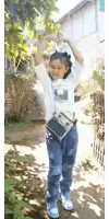 a girl wearing a t-shirt that says " i love paris "