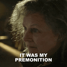 a close up of a woman 's face with the words " it was my premonition " above her