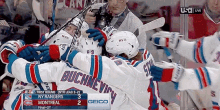 a group of hockey players are huddled together and one of them has the name buchnevici on their jersey