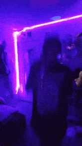 a blurry picture of a room with purple lights