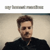 a man with a beard is laying down with the words my honest reaction below him