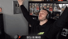 a man wearing headphones and a shirt that says " selixinho " on it