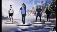 a group of men are dancing in front of a christmas tree in a fortnite game