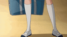 a girl is holding a blue briefcase and wearing white socks