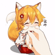 a person is petting a fox with a red flower in her hair .