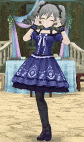 a girl in a blue dress is making a peace sign