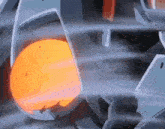 a close up of a machine with a flame coming out of it .