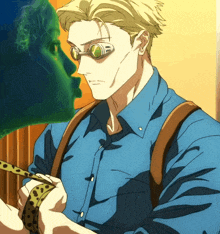 a man wearing a blue shirt and suspenders holds a snake