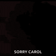 a close up of a dog 's face with the words sorry carol written on the bottom