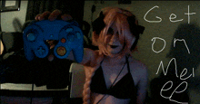a woman in a bikini holds a blue game controller with the words get on my ep written on the wall behind her