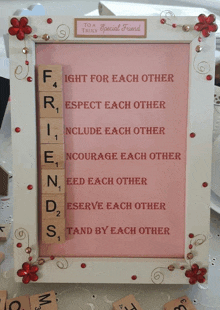 a framed picture with scrabble tiles that says " friends " on it