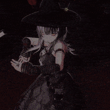 a girl in a witch costume has the letter m on her ring