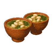 two bowls of soup with white beans and spinach