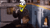 a man is laying on the floor with a cartoon duck on his head and a netflix logo on the bottom