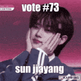 a man with his hands on his face and the words vote # 73 sun jiayang on the bottom