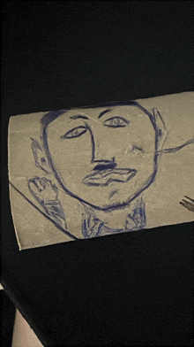 a drawing of a man 's face with a fork in his mouth