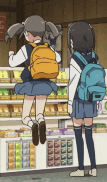 two girls with backpacks are standing in front of a store