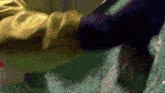 a close up of a person 's foot on a green surface